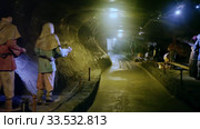 Long tunnel of medieval Wieliczka salt mine with sculptures illustrating daily work of ancient miners (2020 год). Редакционное видео, видеограф Яков Филимонов / Фотобанк Лори