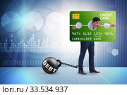 Businessman in credit card burden concept in pillory. Стоковое фото, фотограф Elnur / Фотобанк Лори