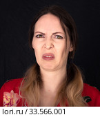 Emotion. Closed woman face with facial expressions over black background. Стоковое фото, фотограф katalinks / Фотобанк Лори