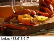 Crayfish with beer on a wooden table. Стоковое фото, фотограф Марина Володько / Фотобанк Лори