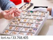 Male jeweler and female client at store. Стоковое фото, фотограф Elnur / Фотобанк Лори