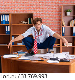 Unhappy businessman sitting in the office. Стоковое фото, фотограф Elnur / Фотобанк Лори