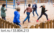 Smiling children playing romp game Touch-last. Стоковое фото, фотограф Яков Филимонов / Фотобанк Лори
