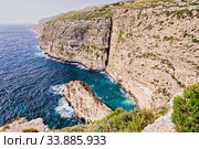 View of rocky clint of northern coast of Malta known as Dingli cliffs (2018 год). Стоковое фото, фотограф Kira_Yan / Фотобанк Лори