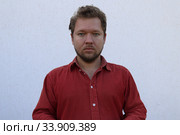 Портрет мужчины с бородой с разными эмоциями на лице. Стоковое фото, фотограф Кузнецов Максим / Фотобанк Лори