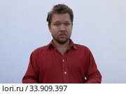 Портрет мужчины с бородой с разными эмоциями на лице. Стоковое фото, фотограф Кузнецов Максим / Фотобанк Лори