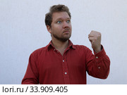 Портрет мужчины с бородой с разными эмоциями на лице. Стоковое фото, фотограф Кузнецов Максим / Фотобанк Лори