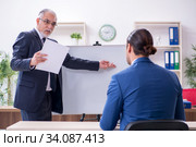 Yound and old employees in business presentation concept. Стоковое фото, фотограф Elnur / Фотобанк Лори