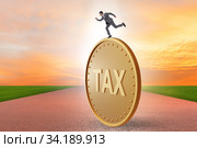 Businessman in tax payment concept. Стоковое фото, фотограф Elnur / Фотобанк Лори