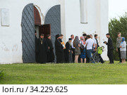Russia, Veliky Novgorod, Yuriev monastery-July 14, 2020: Archimandrite Eli (Nozdrin), Metropolitan Lev of Novgorod and old Russia, Bishop Arseny of Yuriev, together with the brethren of the monastery, leave St. George's Cathedral after the prayer service. Редакционное фото, фотограф Филатова Ирина / Фотобанк Лори