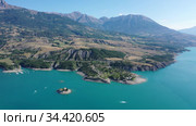 Serene summer landscape of Lake Serre-Poncon, artificial lake surrounded by French Alps, Provence-Alpes-Cote d Azur region. Стоковое видео, видеограф Яков Филимонов / Фотобанк Лори