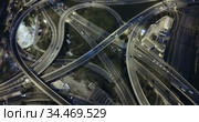 Aerial view of lighted highway road junctions at night. Стоковое видео, видеограф Яков Филимонов / Фотобанк Лори