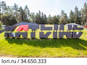 Надпись крупными буквами на холме "КАТЫНЬ". Мемориальный комплекс «Катынь». Село Катынь, Смоленская область (2020 год). Редакционное фото, фотограф Сергей Афанасьев / Фотобанк Лори
