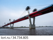Russia, Blagoveshchensk, July 2019: Bridge on the Amur river from Blagoveshchensk to the Chinese city of Heihe in summer. Стоковое фото, фотограф Катерина Белякина / Фотобанк Лори