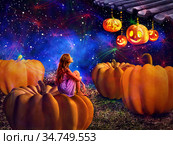 Kid on pumkin in halloween night dreems fall harvest holiday. Стоковое фото, фотограф Gennadiy Poznyakov / Фотобанк Лори