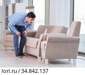 Young man shopping in furniture store. Стоковое фото, фотограф Elnur / Фотобанк Лори