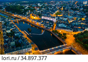 Evening aerial view of Laval with buildings, river Mayenne and old bridge. Стоковое фото, фотограф Яков Филимонов / Фотобанк Лори