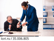 Police inspector arresting old judge in court. Стоковое фото, фотограф Elnur / Фотобанк Лори