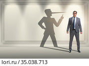 Concept of businessman liar with his shadow. Стоковое фото, фотограф Elnur / Фотобанк Лори
