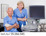 Qualified doctors near modern ultrasound machine. Стоковое фото, фотограф Яков Филимонов / Фотобанк Лори