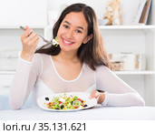 Smiling girl eating tasty sala. Стоковое фото, фотограф Яков Филимонов / Фотобанк Лори