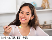 Smiling girl eating tasty sala. Стоковое фото, фотограф Яков Филимонов / Фотобанк Лори