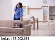 Young male employee being fired from his work at home. Стоковое фото, фотограф Elnur / Фотобанк Лори