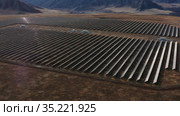 Солнечная электростанция в горном Алтае. Вид с воздуха. Solar power plant in the Altai Mountains. Aerial view. Стоковое видео, видеограф Евгений Романов / Фотобанк Лори