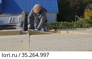 Roofing work. Installation of insulation for insulation of the roof of a private house. Стоковое видео, видеограф Константин Мерцалов / Фотобанк Лори