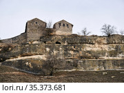 View of the Karaite kenassas on the edge of a cliff in the ancient cave city of Chufut-Kale, Crimea (2021 год). Редакционное фото, фотограф Евгений Харитонов / Фотобанк Лори