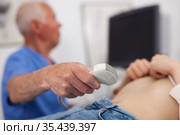 Doctor examination pregnant woman with ultrasonography device. Стоковое фото, фотограф Яков Филимонов / Фотобанк Лори