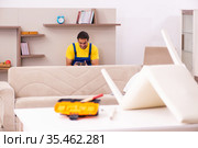 Young male carpenter stealing jewelry at home. Стоковое фото, фотограф Elnur / Фотобанк Лори