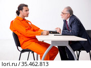 Young captive meeting with advocate in pre-trial detention. Стоковое фото, фотограф Elnur / Фотобанк Лори