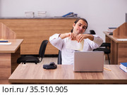 Young male employee unhappy with office prank in the office. Стоковое фото, фотограф Elnur / Фотобанк Лори