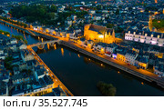 Evening aerial view of Laval with buildings, river Mayenne and old bridge. Стоковое фото, фотограф Яков Филимонов / Фотобанк Лори