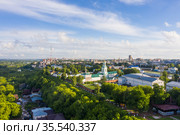 Kirov and the high bank of the river Vyatka and the Alexander Grin Embankment and Trifonov Monastery on a sunny summer day. Редакционное фото, фотограф Mikhail Starodubov / Фотобанк Лори