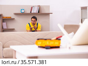 Young male carpenter stealing jewelry at home. Стоковое фото, фотограф Elnur / Фотобанк Лори
