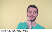 Close Shot Of Young Man With With A Toothache, Suffering and Touching His Cheek. Стоковое видео, видеограф Mihail Mihaylov / Фотобанк Лори