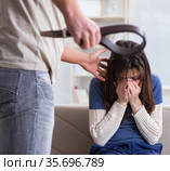 Desparate wife with aggressive husband in domestic violence conc. Стоковое фото, фотограф Elnur / Фотобанк Лори