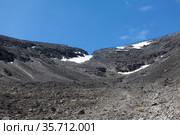 Snowy mountain pass with erosion and rockfall in the Khibiny mountains. The Kola peninsula, Russia. Стоковое фото, фотограф Кекяляйнен Андрей / Фотобанк Лори