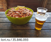 Shrimps with beer on a wooden table. Стоковое фото, фотограф Марина Володько / Фотобанк Лори