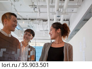 Coworkers walking out of the meeting room. Стоковое фото, агентство Ingram Publishing / Фотобанк Лори