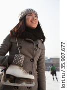 Young woman ice skating portrait, Beijing. Стоковое фото, агентство Ingram Publishing / Фотобанк Лори