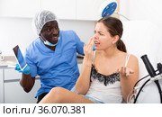 Dissatisfied woman examining face after cosmetology procedures. Стоковое фото, фотограф Яков Филимонов / Фотобанк Лори