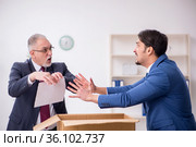 Two male employees in dismissal concept. Стоковое фото, фотограф Elnur / Фотобанк Лори