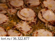Frying marinated pork in copious quentities of oil in a pan. Стоковое фото, фотограф Tamara Kulikova / Фотобанк Лори
