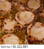 Frying marinated pork in copious quentities of oil in a pan. Стоковое фото, фотограф Tamara Kulikova / Фотобанк Лори