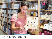 Woman choosing sundries storage box. Стоковое фото, фотограф Яков Филимонов / Фотобанк Лори