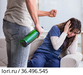 Drunk husband abusing wife in domestic violence concept. Стоковое фото, фотограф Elnur / Фотобанк Лори