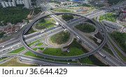 Aerial view of transport interchanges with roundabout traffic. Стоковое фото, фотограф Данил Руденко / Фотобанк Лори